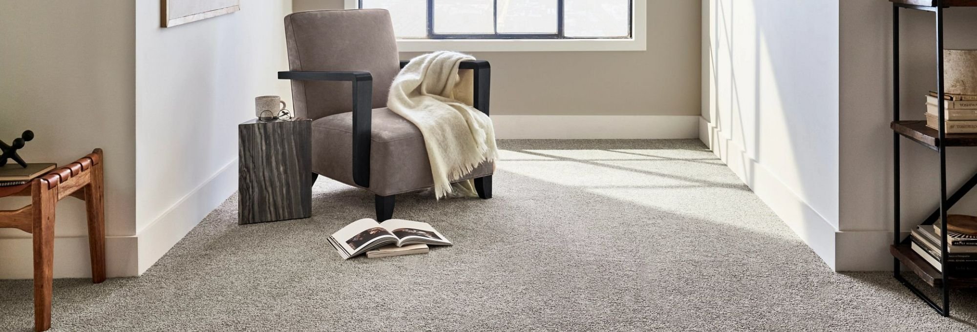 comfortable armchair next to a window with gray soft carpet on on Dallas Dr, Denton, Texas area