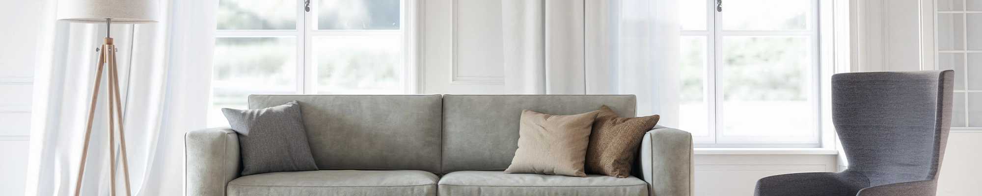 living room with grey furniture in front of large window on Dallas Dr, Denton, Texas area