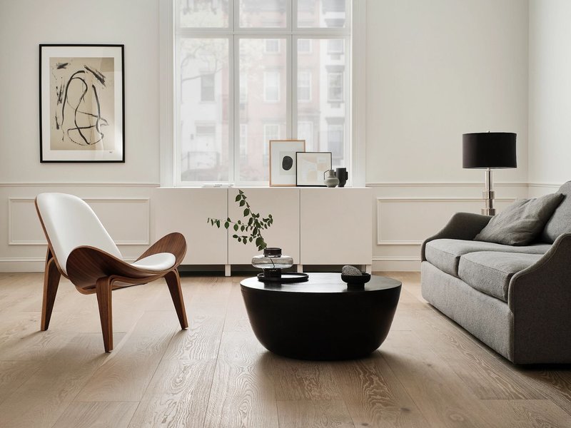 living room flooring with beige chair and gray sofa